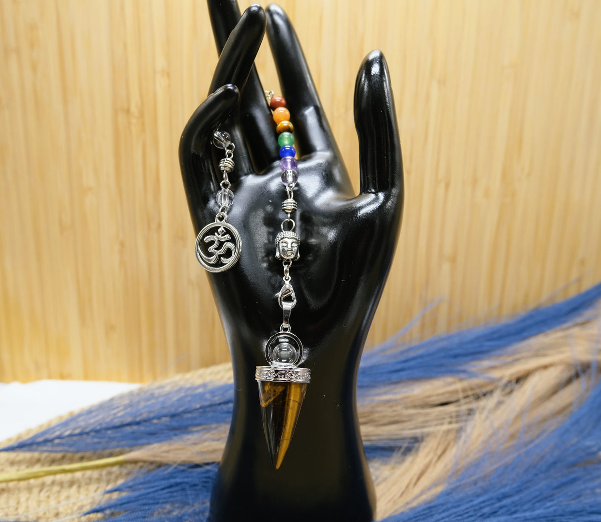 Ohm Chakra Tiger Eye Pendulum | These pendulums are bracelet, pendant and traditional pendulum